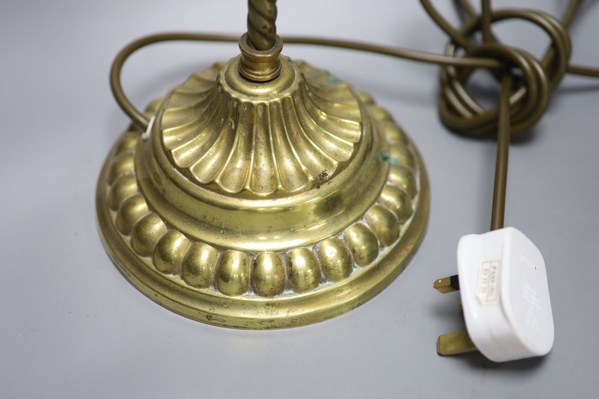 A brass anglepoise shell desk lamp